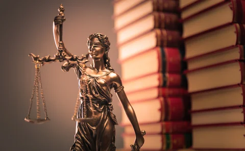 law books and justice statue 