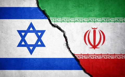 Israel and Iran flags against a cracked background
