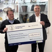 Cheque being handed over to Insurance Museum from National Lottery