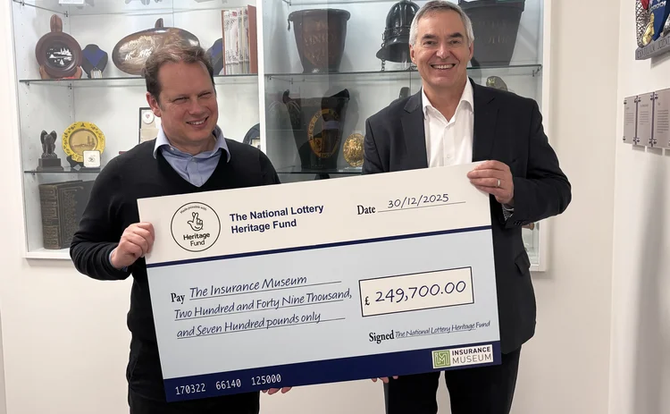 Cheque being handed over to Insurance Museum from National Lottery